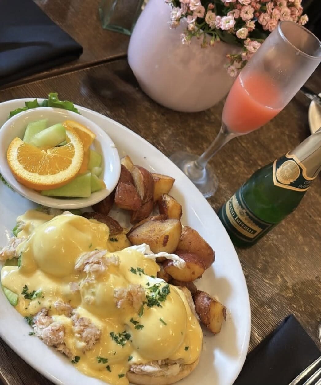 Crab eggs benedict with a mimosa