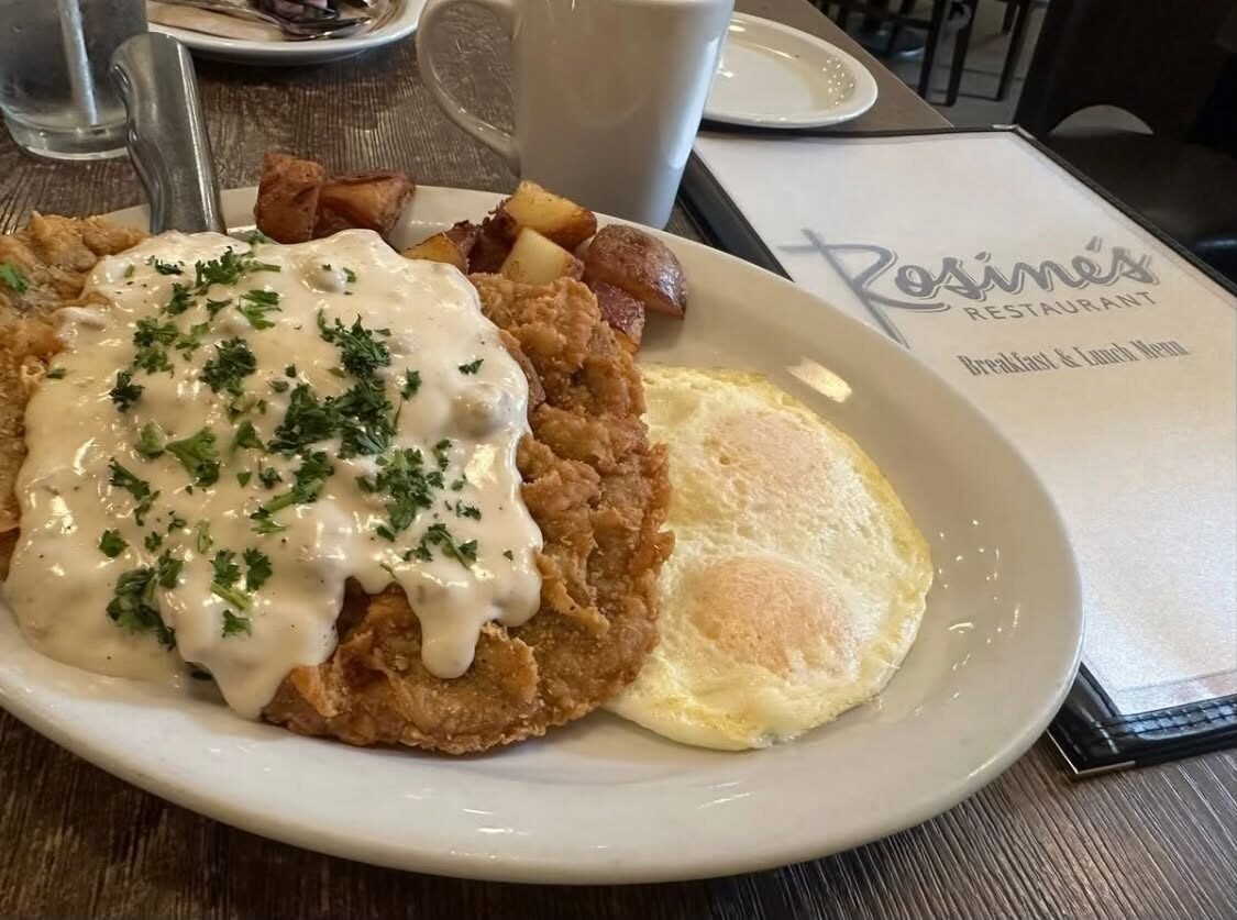 Chicken fried steak with country gravy and eggs
